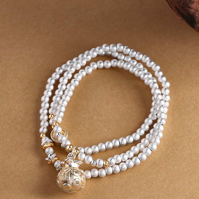 999 fine silver Koi Fish fortune pouch bracelet on sand