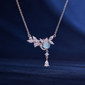 S925 silver cat necklace with pale blue center on navy fabric