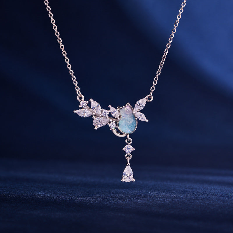 S925 silver cat necklace with pale blue center on navy fabric