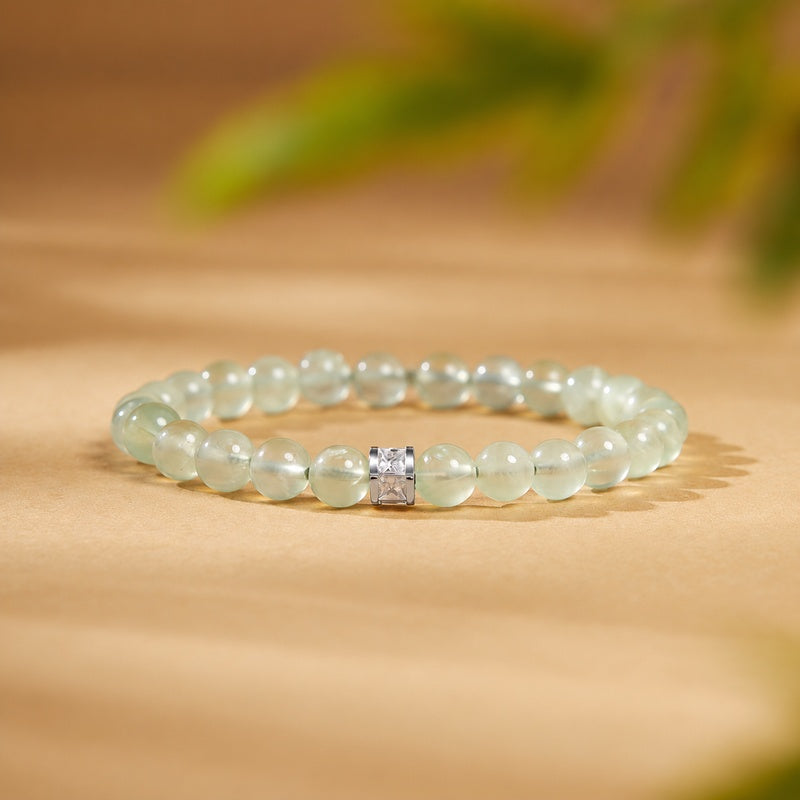 Prehnite bracelet with a sparkling spacer on a warm golden background