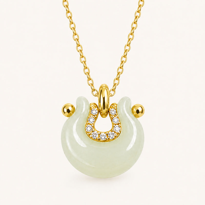 Hetian jade crescent peace lock necklace on ivory background