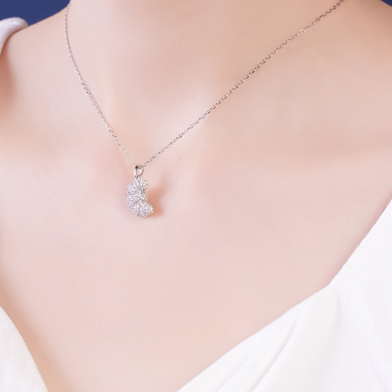 Model wearing petite S925 silver croissant pendant necklace