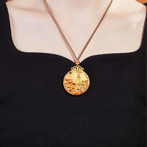 Supplier model wearing Koi Fish necklace