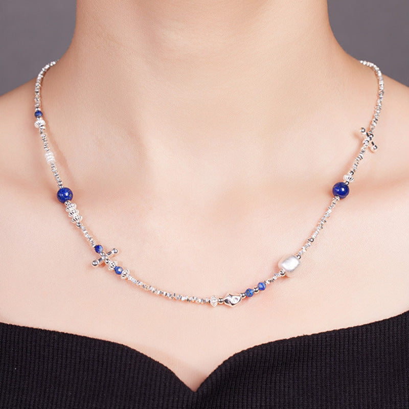 Model wearing Starry Hymn lapis lazuli and silver necklace front view