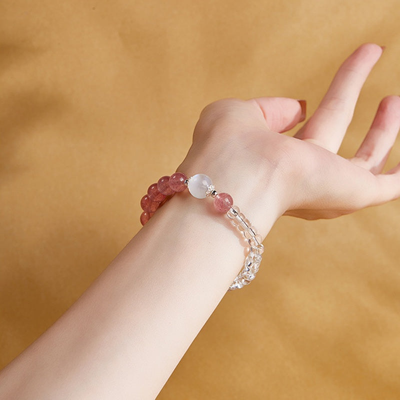 Original model wearing strawberry crystal bracelet with pale moonstone focal bead