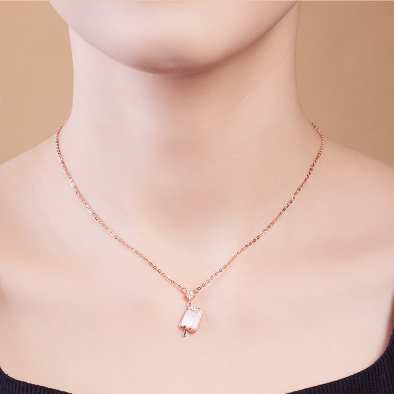 Model wearing rose gold color pink popsicle pendant necklace