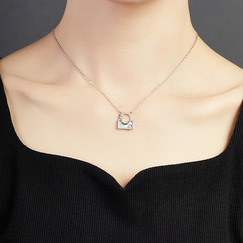 Supplier model wearing the silver star lock necklace