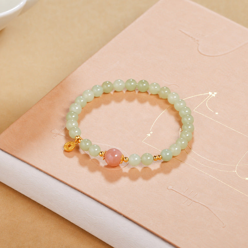 Oblique view of nephrite jade and orange moonstone bracelet