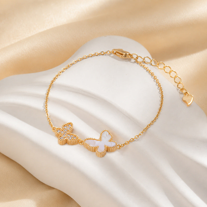 S925 silver double butterfly bracelet on white display