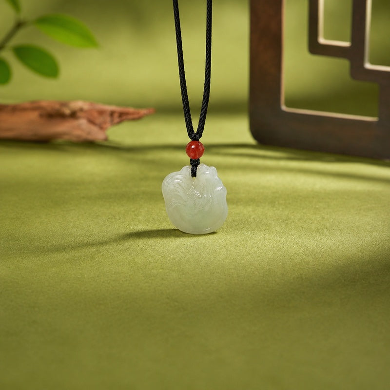 Front view of nephrite jade rooster pendant with red agate