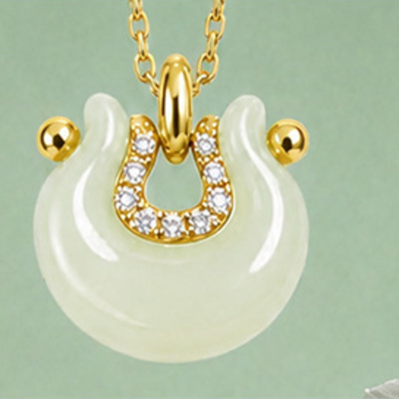 Hetian jade crescent peace lock pendant front detail