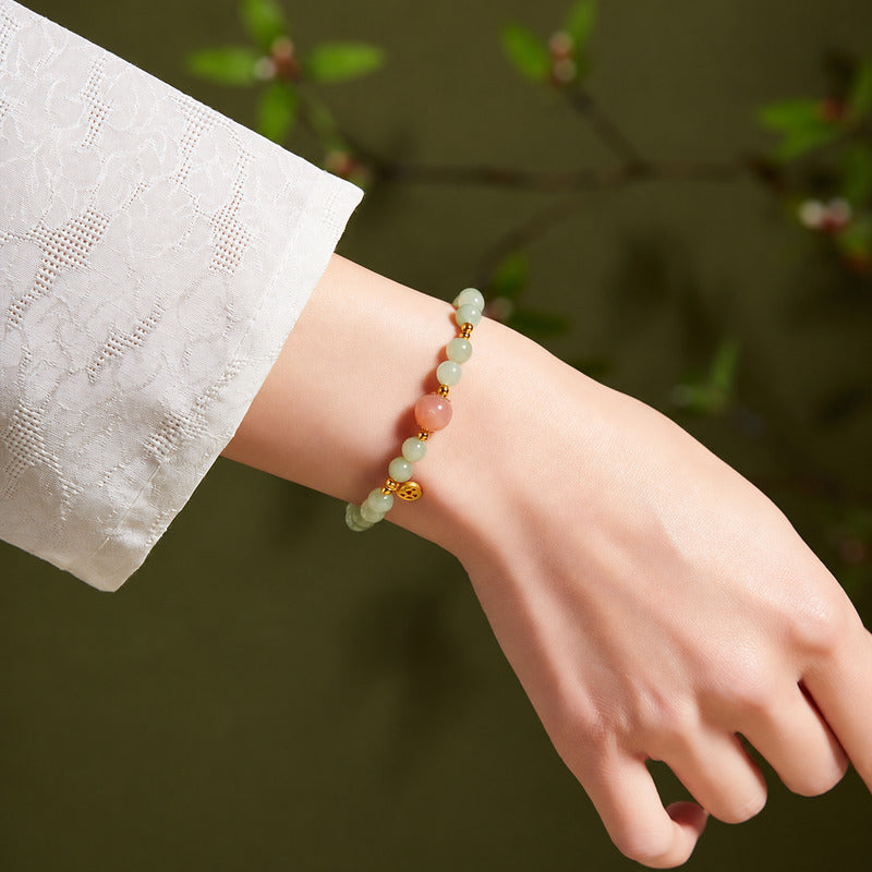 Supplier wrist view of nephrite jade and orange moonstone bracelet
