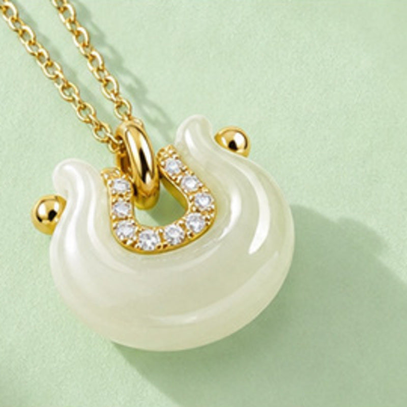 Hetian jade crescent peace lock pendant angled detail