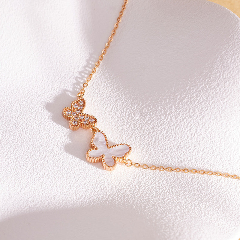 Side detail of butterfly necklace plating and stone settings