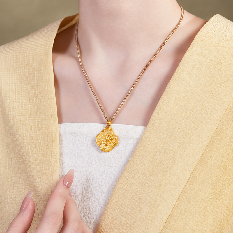 Angled supplier model wearing lotus pendant