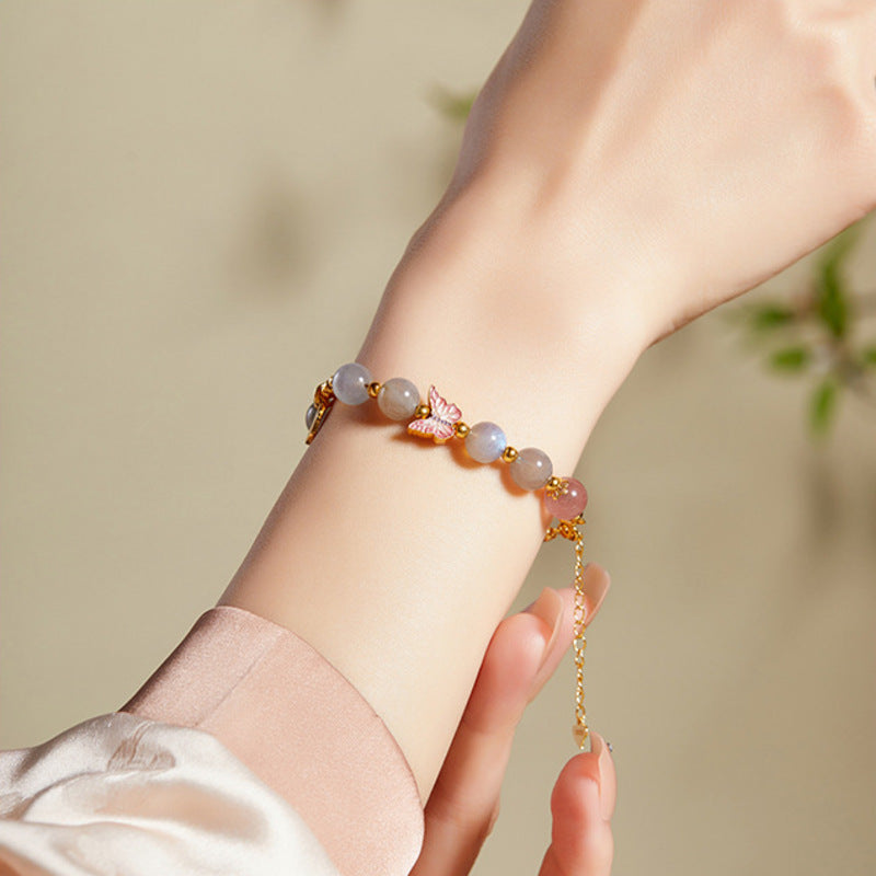 Side view of adjustable gemstone bracelet worn on wrist