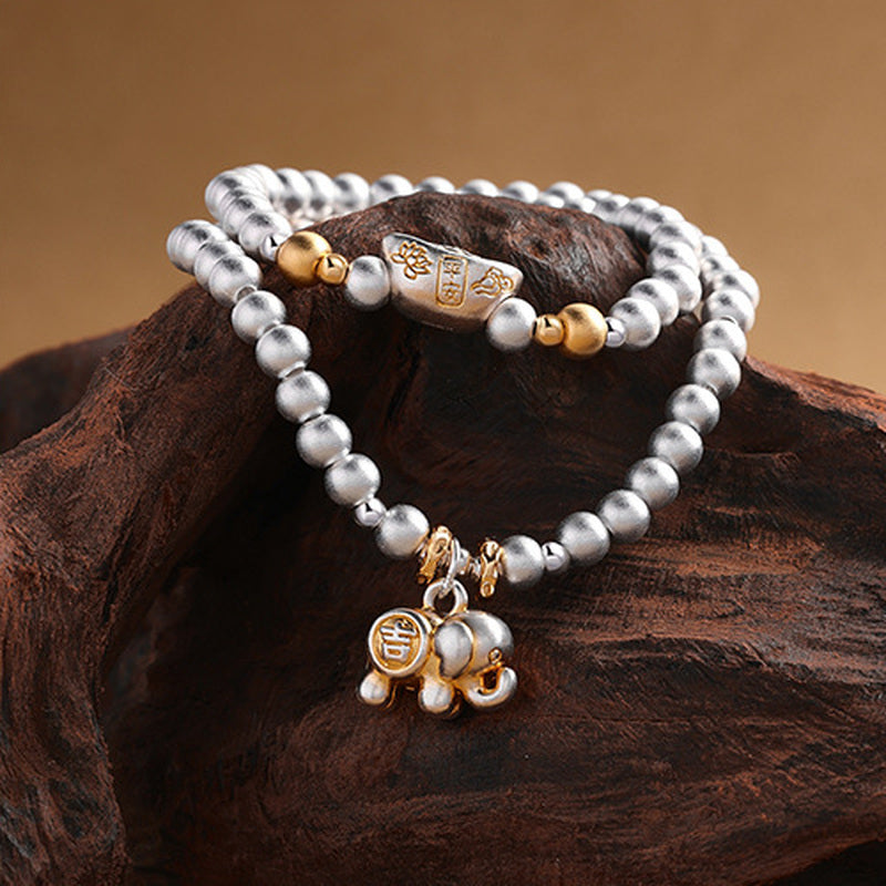 Elephant and fortune ingot silver bracelet detail