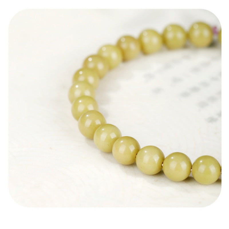 Close view of pale green agate bead color and luster