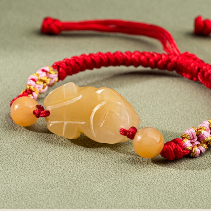Hand-Woven Golden Silk Jade PiXiu Bracelet – Protection, Peace & Vitality