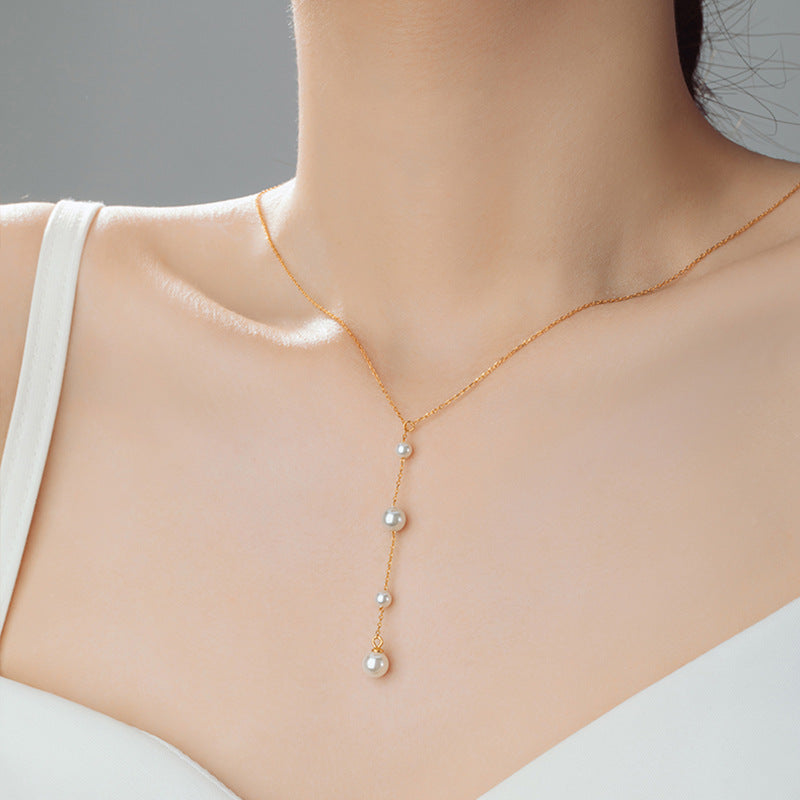 Pearl Y Necklace-A Delicate Trail of Light