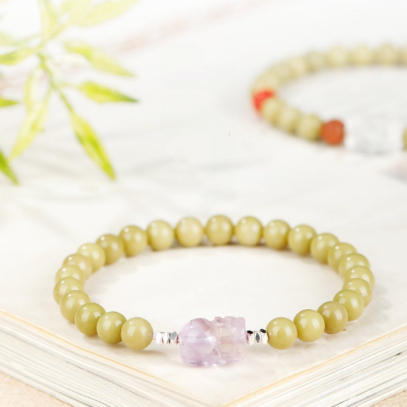 Full green agate amethyst Pixiu bracelet on a soft neutral surface