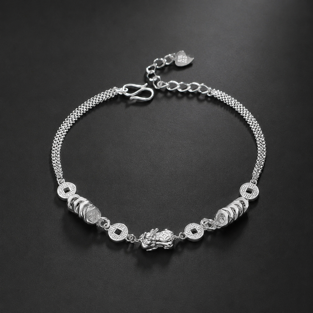 999 fine silver Pixiu and coin bracelet on a dark background