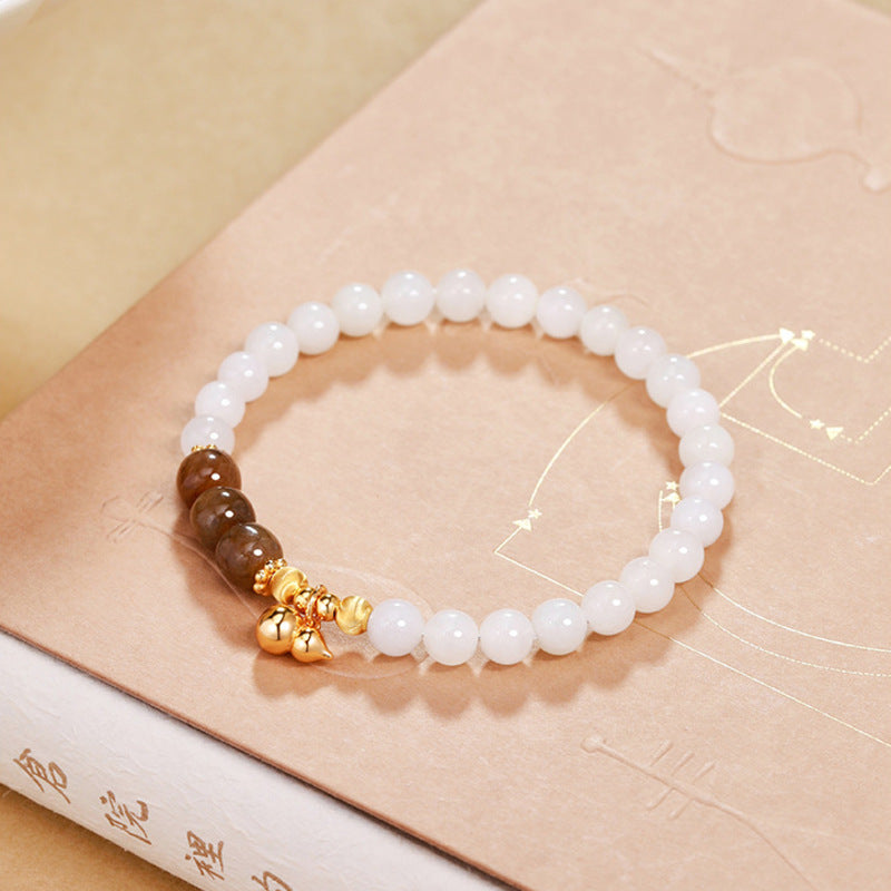 White jade bracelet with caramel beads and gourd charm