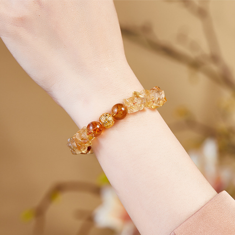 Original supplier photograph of the coin and Yellow Tower Quartz bracelet worn on the wrist