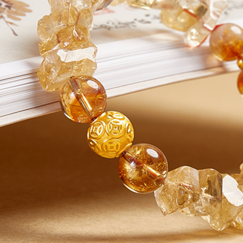Side detail of the polished coin bead and angular stones