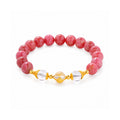 Complete rhodonite and clear quartz bracelet on white