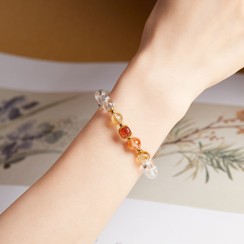 Supplier model wearing the clear quartz and red flower quartz bracelet