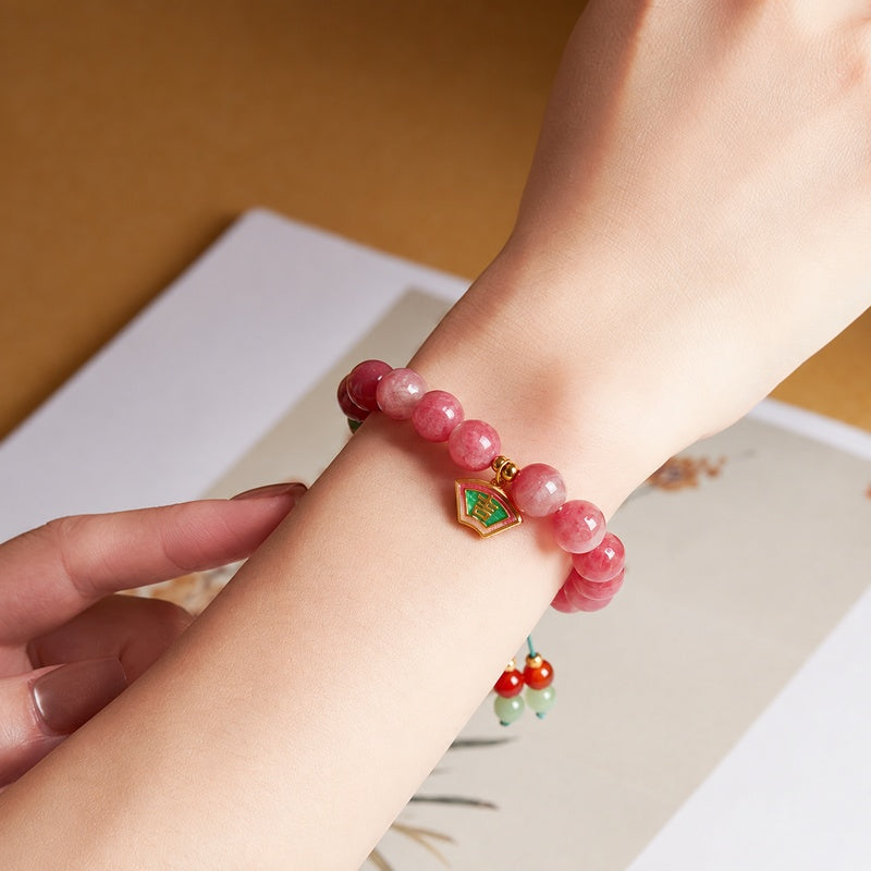 Supplier model wearing the Rhodonite Ji charm bracelet