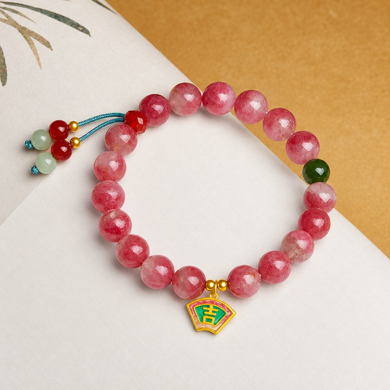 Rhodonite bracelet with Ji charm on ivory paper