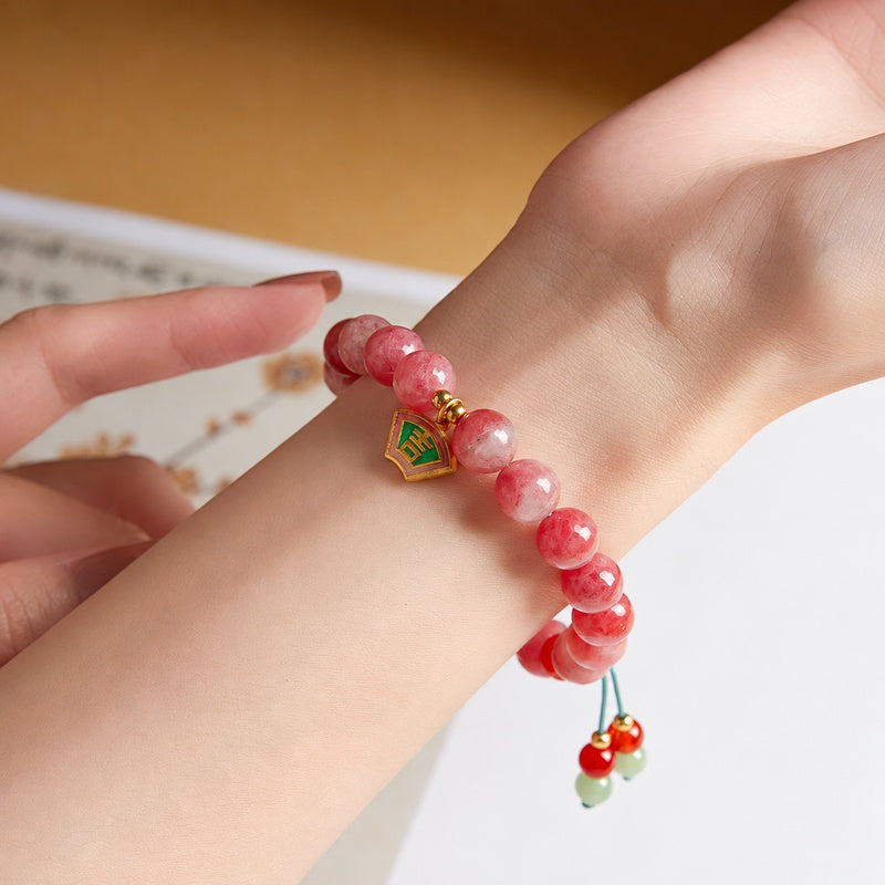Close view of the supplier model wearing the Ji charm bracelet