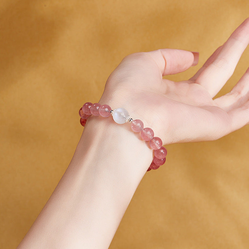 Original model wearing the pink strawberry crystal and moonstone bracelet