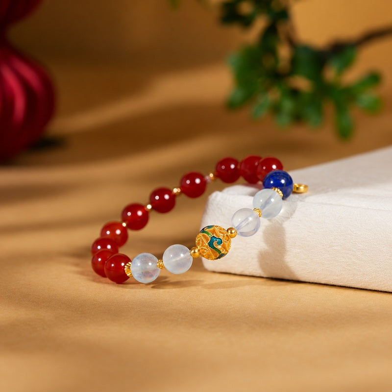 Angled view of the enamel red agate bracelet with lapis lazuli accent