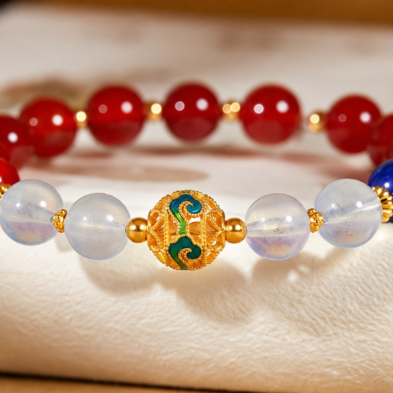 Close detail of the patterned cold-enamel bead and filled aquamarine