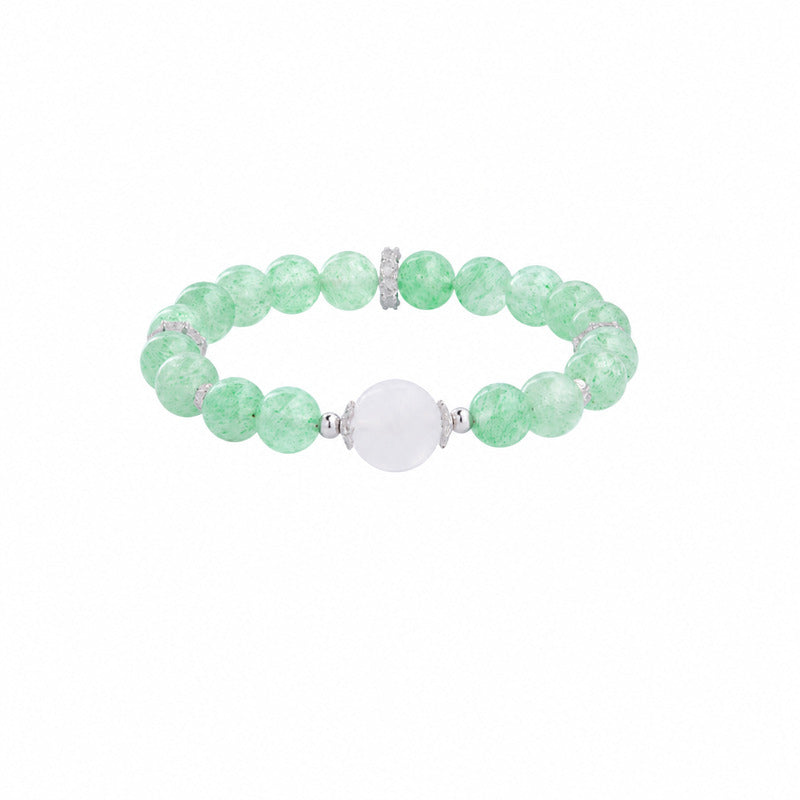 Green strawberry crystal and moonstone stretch bracelet on a white background