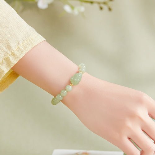 Original supplier wrist photograph of the nephrite jade toad bracelet