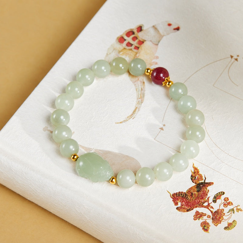 Full nephrite jade bracelet with carved toad and red Zijinsha bead