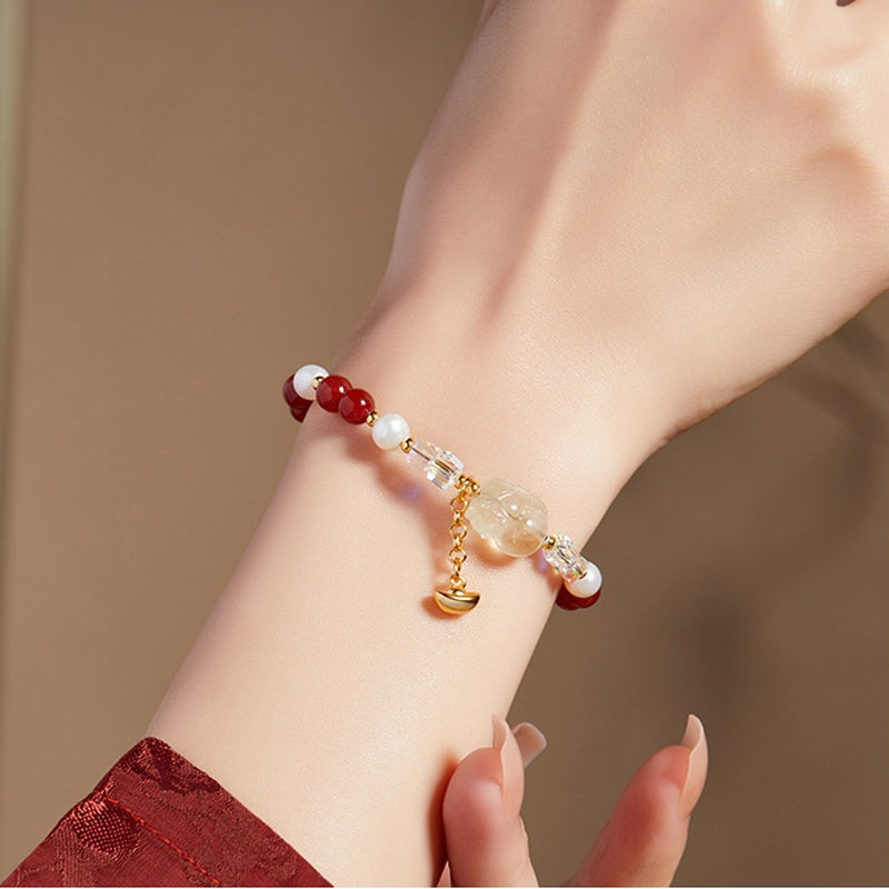 Supplier model wearing the lemon quartz Pixiu freshwater pearl and red agate bracelet