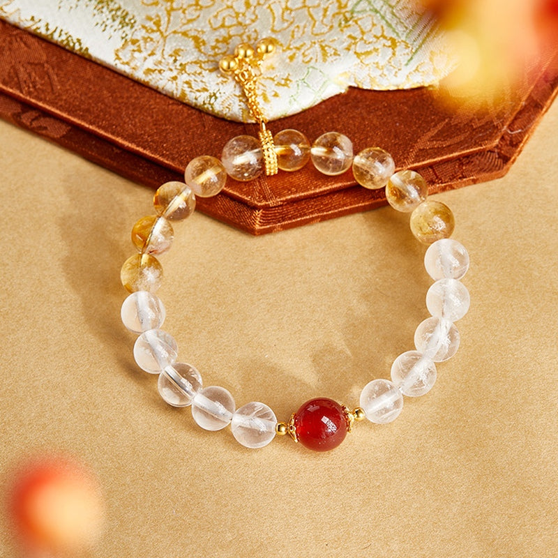 Overhead bracelet view showing yellow tower crystal beads and tassel