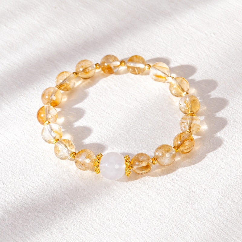 Yellow phantom quartz and blue moonstone bracelet photographed from above