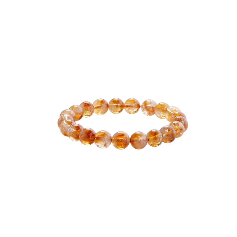 Polished yellow phantom quartz round bead bracelet on white background
