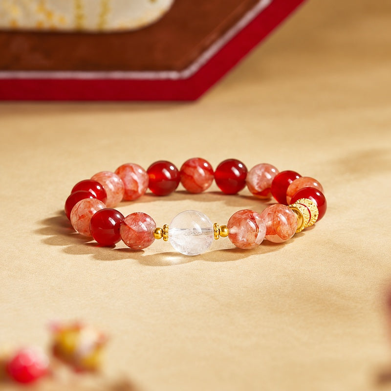 Red agate and red inclusion quartz bracelet on a warm golden background