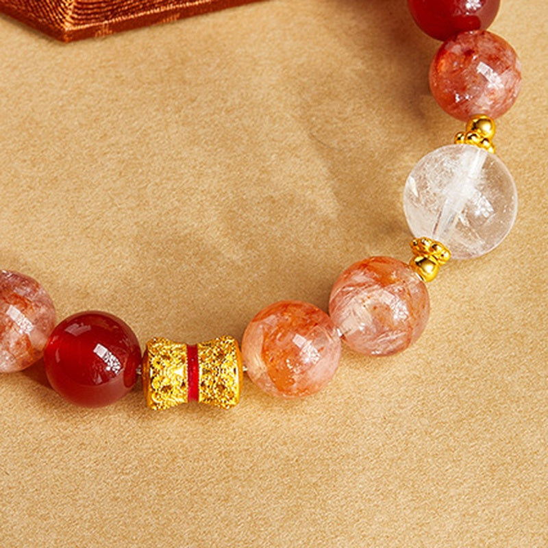 Close view of red agate bracelet with textured focal bead
