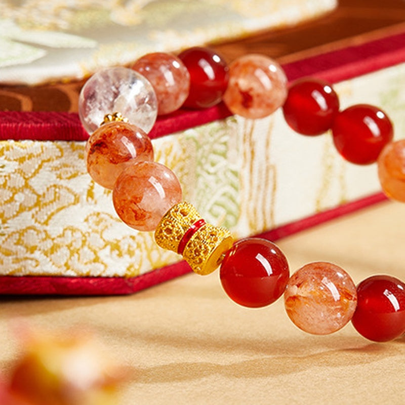 Polished red agate and orange inclusion quartz bracelet bead detail