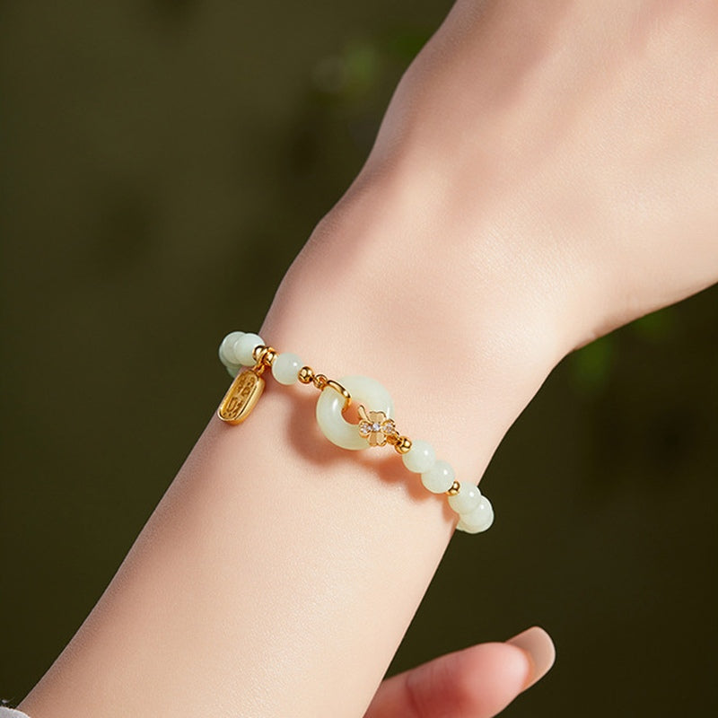 Supplier model wearing pale green nephrite jade peace roundel bracelet