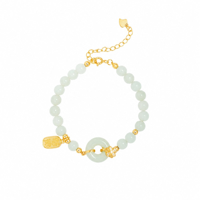 Nephrite jade bracelet with adjustable chain displayed against a white background