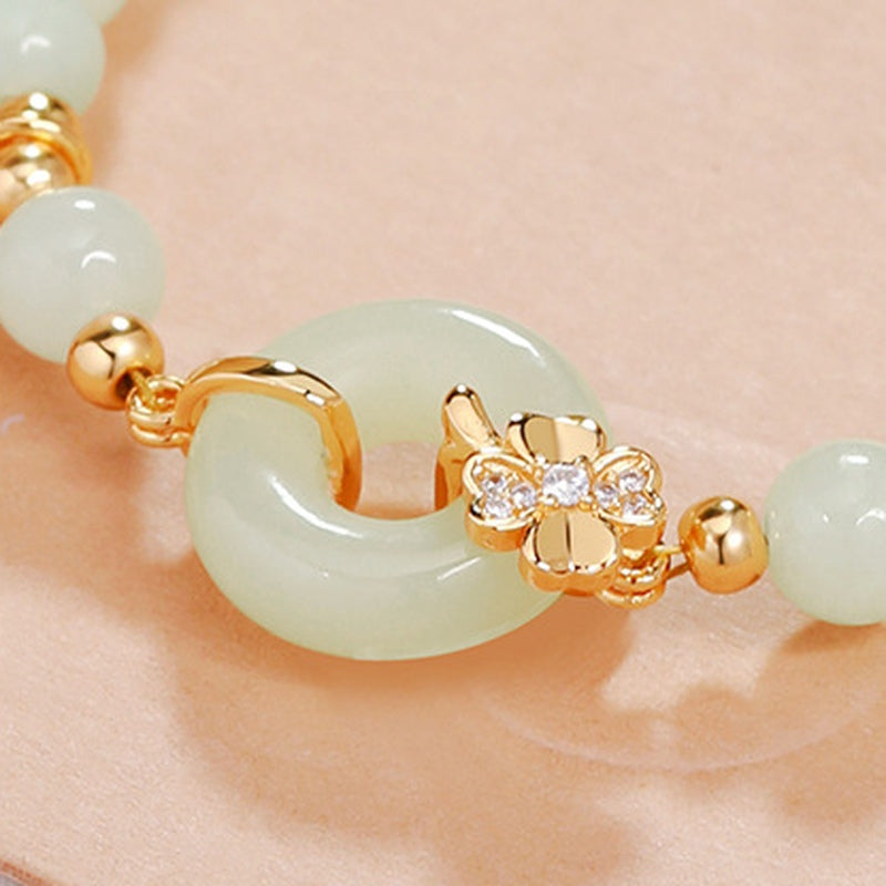 Close view of jade peace roundel and sparkling floral connector